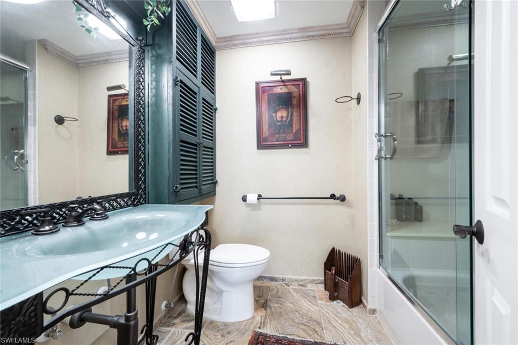 839 Reef Point Circle, Unit 41 Naples, FL 34108 - Photo 24 of 37 a bathroom with a sink and a toilet