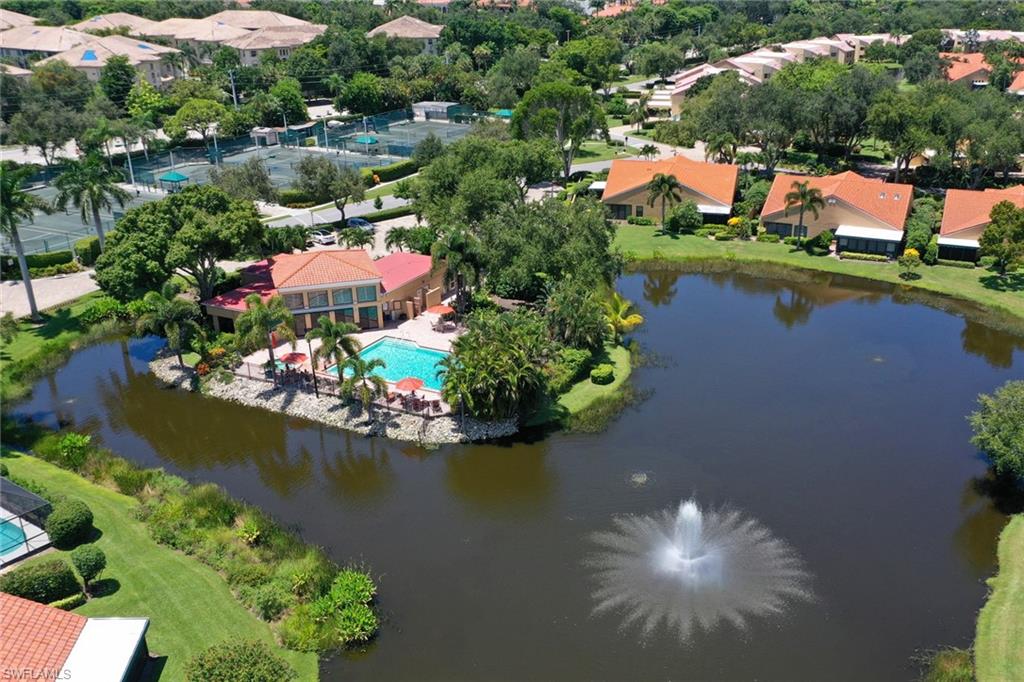 839 Reef Point Circle, Unit 41 Naples, FL 34108 - Photo 30 of 37 an aerial view of residential houses with outdoor space and lake view