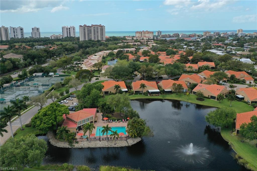 839 Reef Point Circle, Unit 41 Naples, FL 34108 - Photo 32 of 37 an aerial view of residential houses with outdoor space and lake view