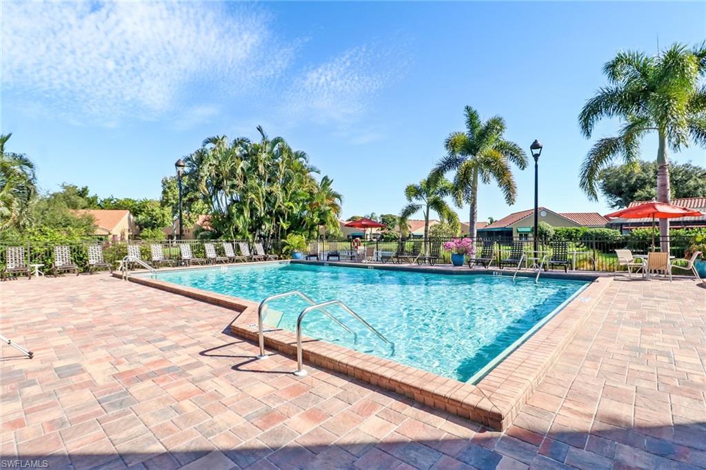 839 Reef Point Circle, Unit 41 Naples, FL 34108 - Photo 36 of 37 a view of swimming pool with a patio and a yard