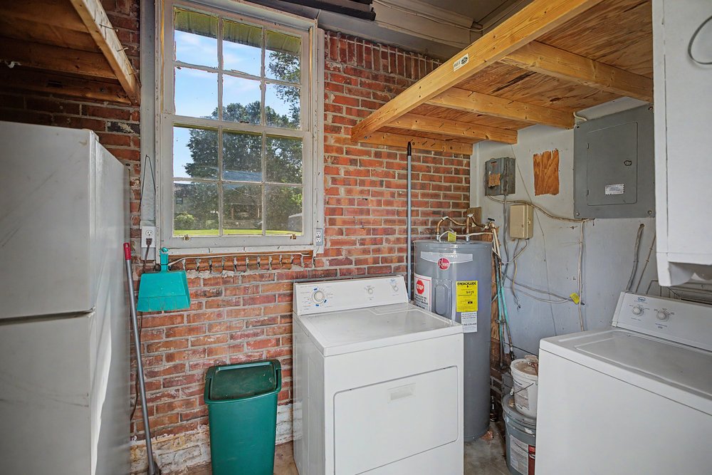 115 Brunson Drive Pickens, SC 29671 - Photo 22 of 29 Functional utility room with exposed brick and a practical laundry setup.