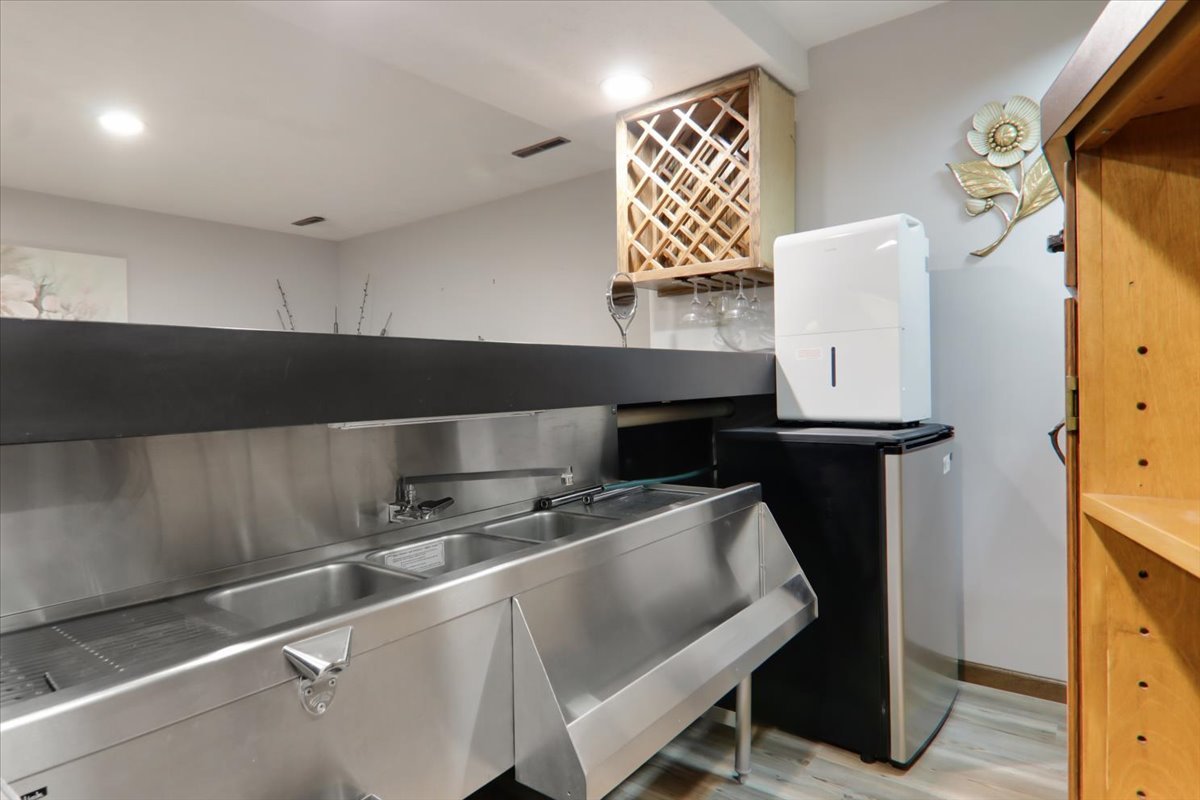 2215 Woodfield Road Bloomington, IL 61704 - Photo 23 of 35 a kitchen with a sink cabinets and appliances
