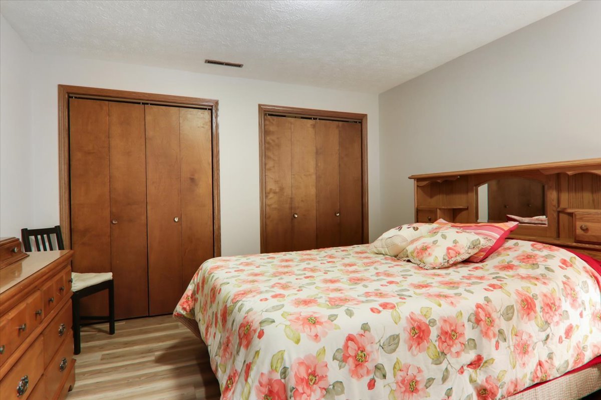 2215 Woodfield Road Bloomington, IL 61704 - Photo 24 of 35 a bedroom with a bed and a window