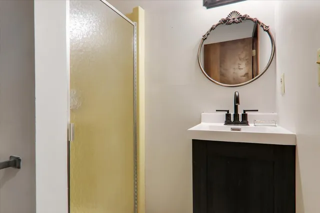 a bathroom with a sink and a mirror