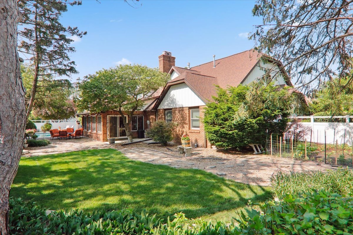 2215 Woodfield Road Bloomington, IL 61704 - Photo 35 of 35 a view of a house with a yard and sitting area