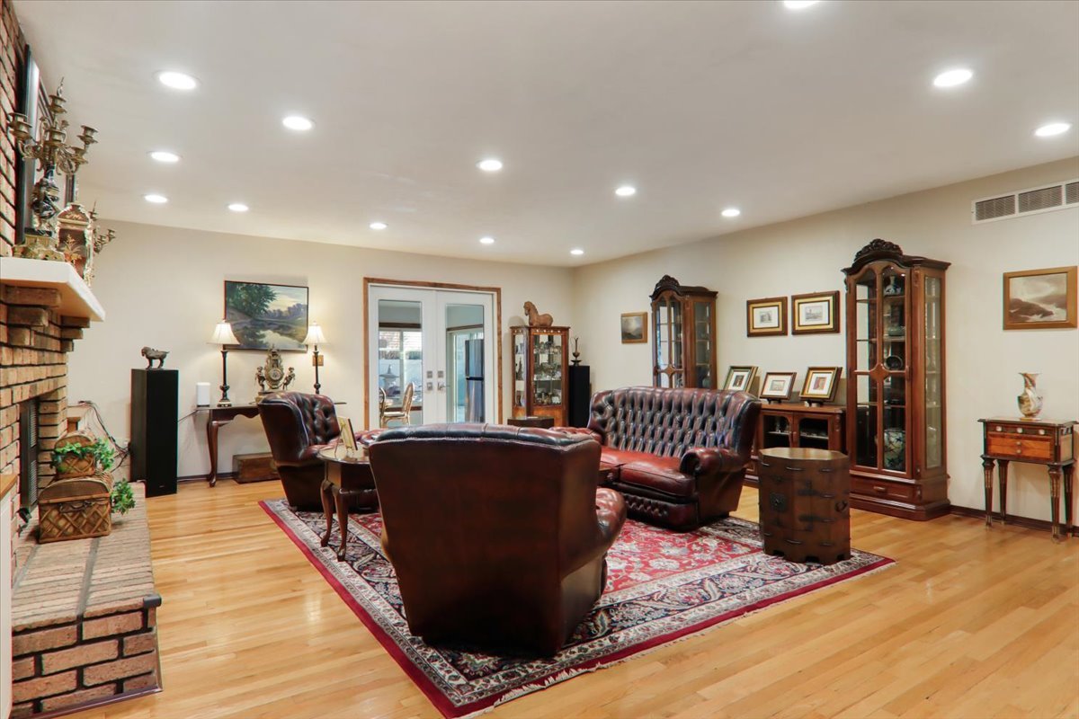 2215 Woodfield Road Bloomington, IL 61704 - Photo 4 of 35 a living room with furniture windows and wooden floor