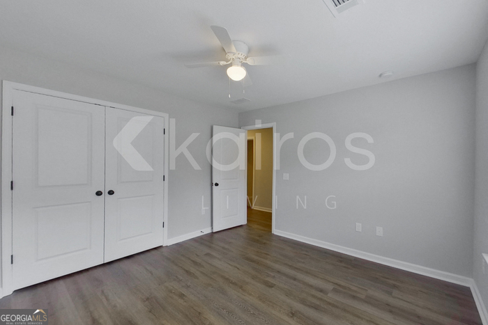 122 Cottage Grove Road Brunswick, GA 31525 - Photo 12 of 20 a view of an empty room with wooden floor