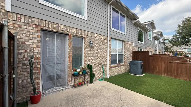 a backyard of a house with outdoor seating