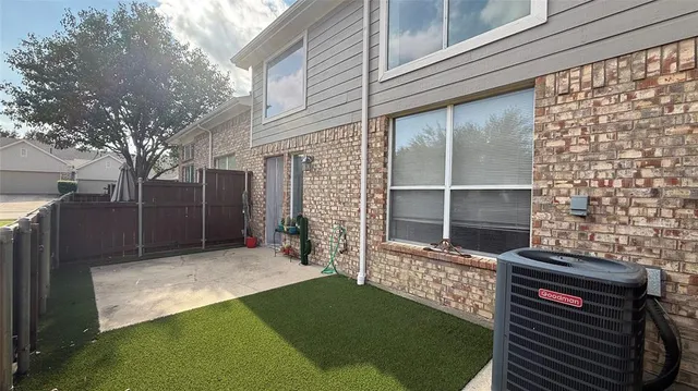 a view of a backyard with a fence