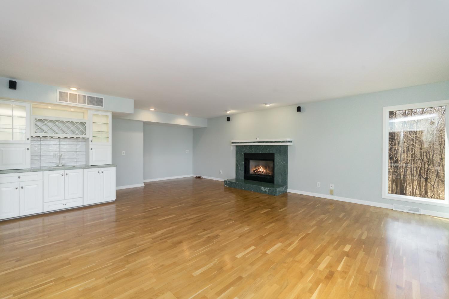 473 Roxbury Road Valparaiso, IN 46385 - Photo 23 of 51 a view of empty room with wooden floor and fireplace