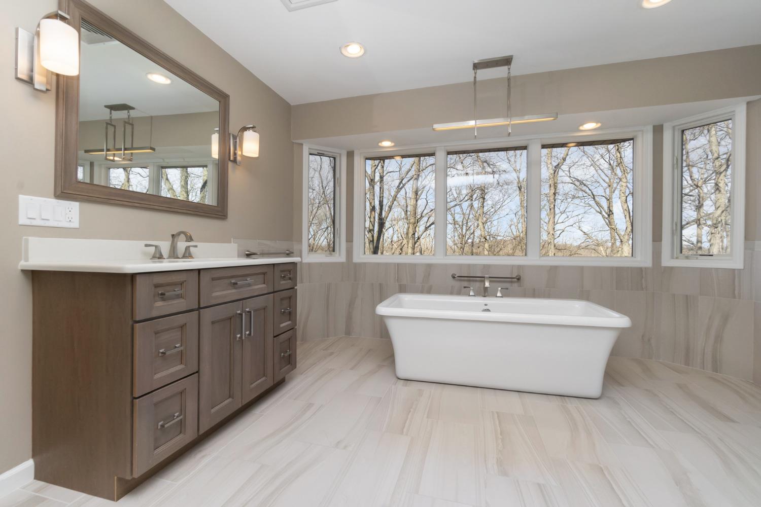 473 Roxbury Road Valparaiso, IN 46385 - Photo 26 of 51 a bathroom with a double vanity sink bathtub mirror and double
