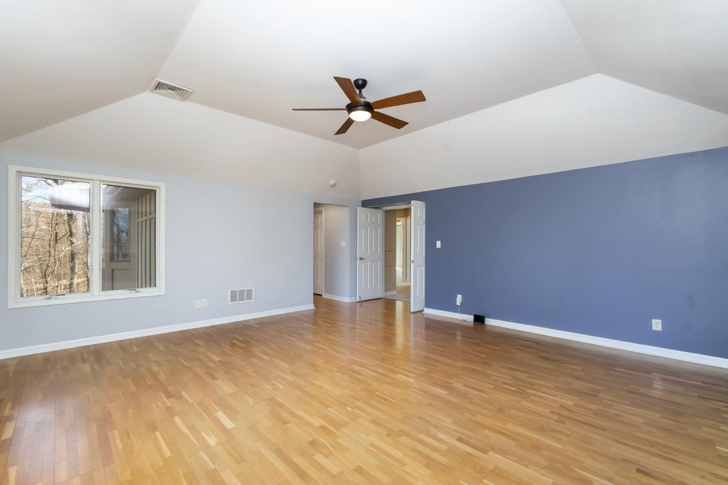473 Roxbury Road Valparaiso, IN 46385 - Photo 32 of 51 a view of an empty room with chandelier fan and a window