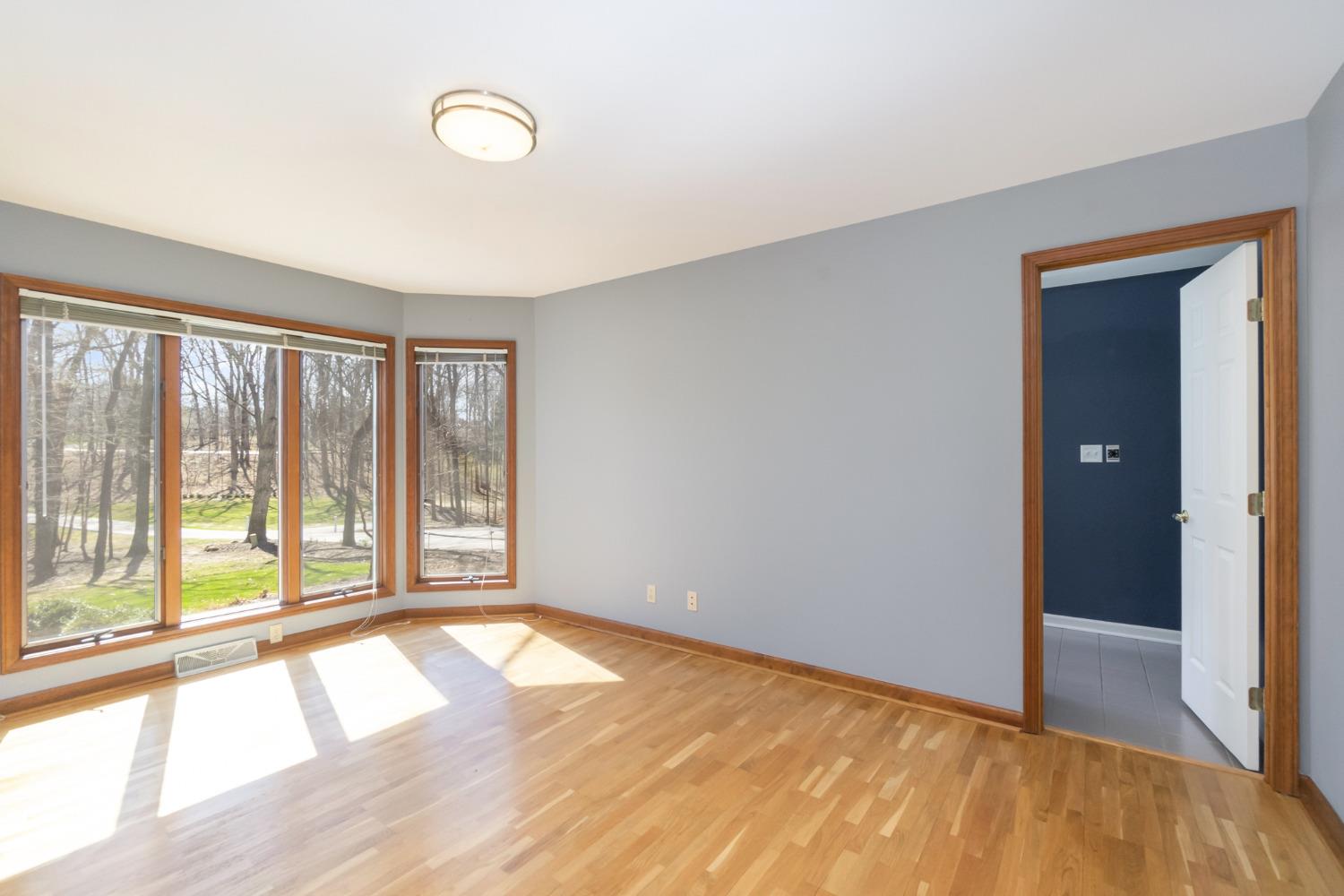 473 Roxbury Road Valparaiso, IN 46385 - Photo 37 of 51 a view of an empty room with wooden floor and a window