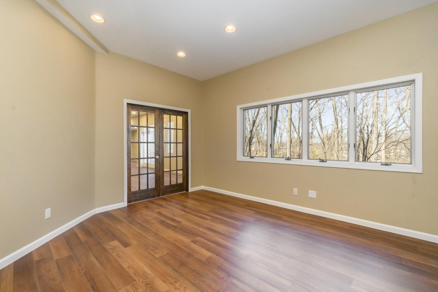 473 Roxbury Road Valparaiso, IN 46385 - Photo 41 of 51 a view of an empty room with wooden floor and a window