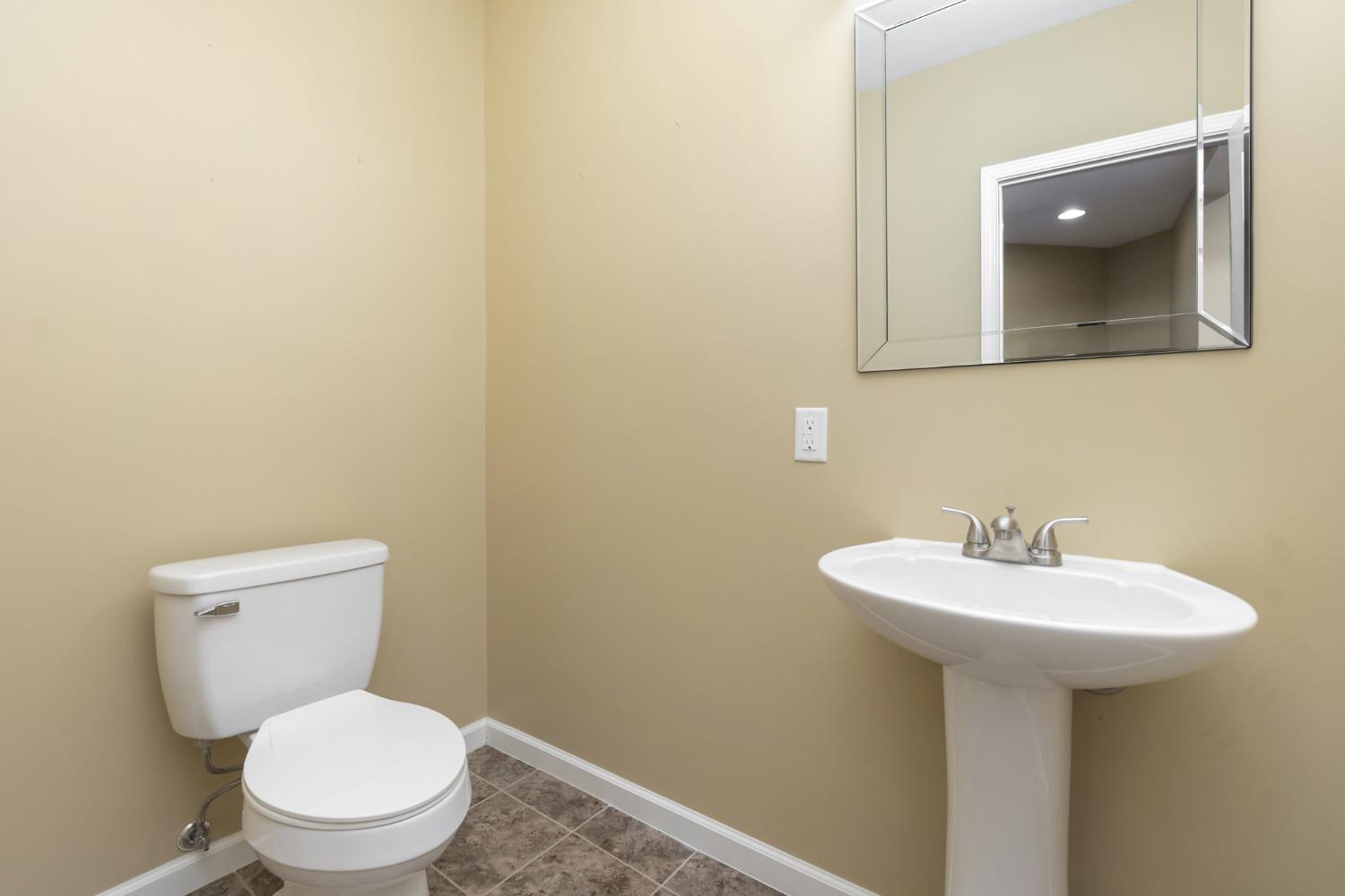 473 Roxbury Road Valparaiso, IN 46385 - Photo 43 of 51 a bathroom with a toilet sink and mirror
