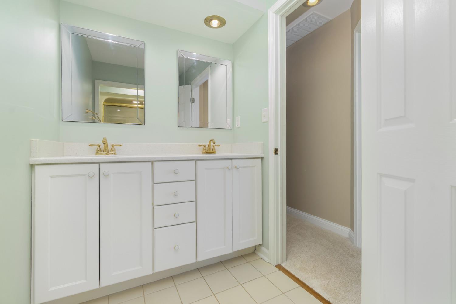 473 Roxbury Road Valparaiso, IN 46385 - Photo 48 of 51 a bathroom with a double vanity sink and mirror