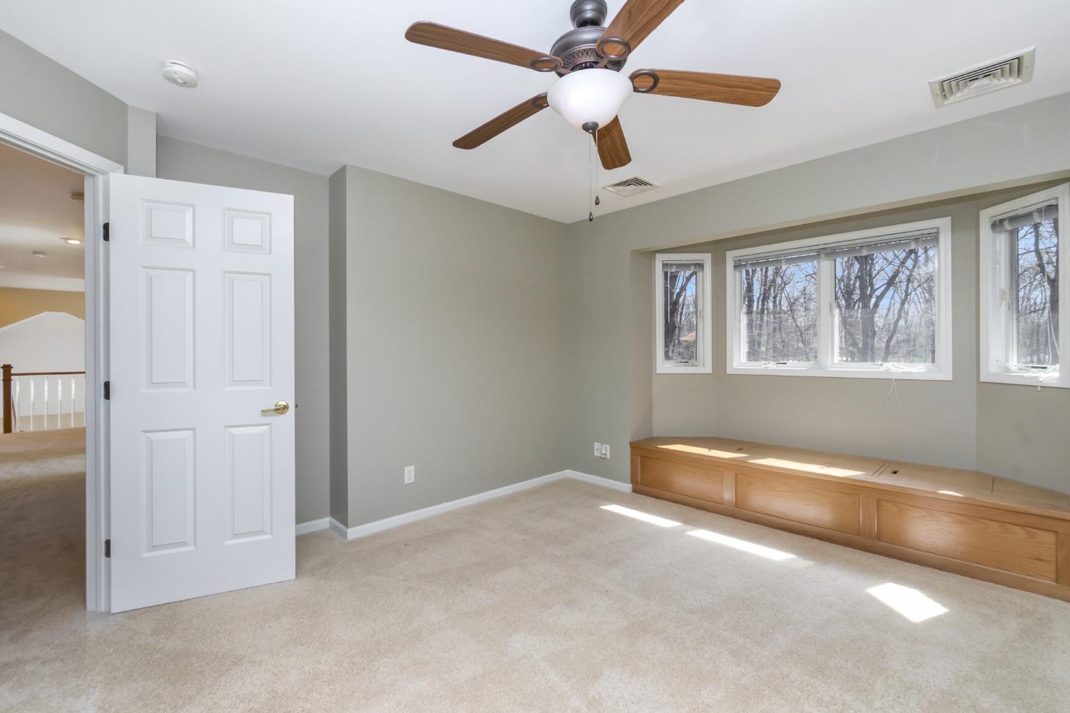 473 Roxbury Road Valparaiso, IN 46385 - Photo 51 of 51 an empty room with chandelier fan and windows