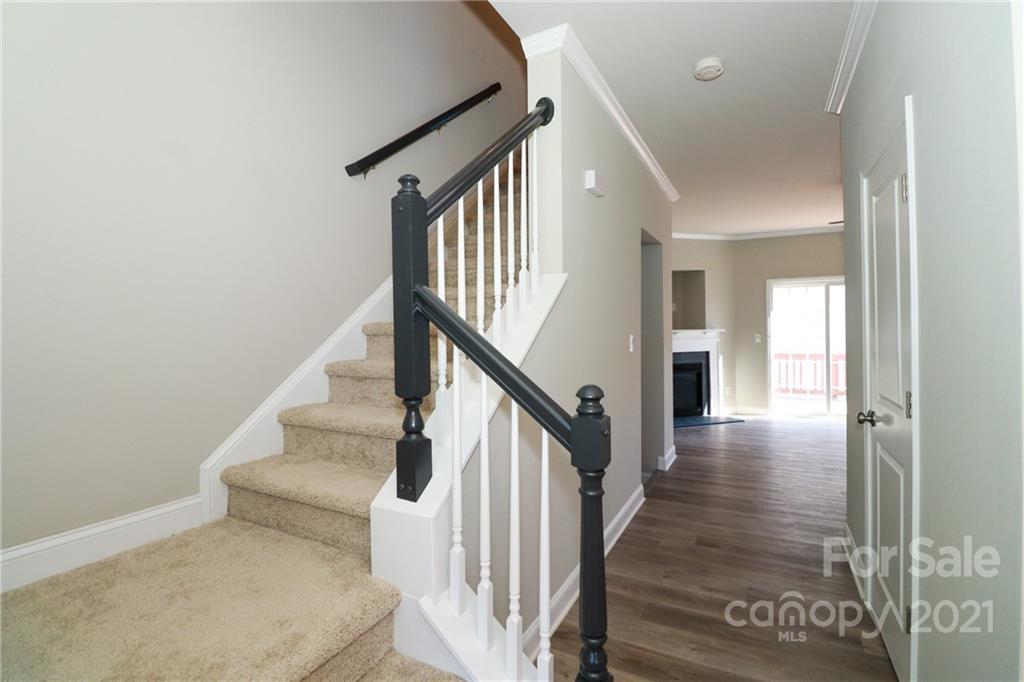 1265 Amber Ridge Road Northwest Concord, NC 28027 - Photo 18 of 26 a view of entryway and hall with wooden floor