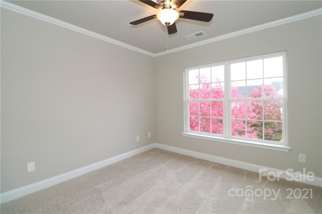 1265 Amber Ridge Road Northwest Concord, NC 28027 - Photo 24 of 26 an empty room with a window and a fan