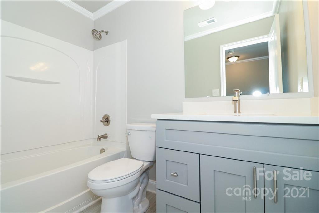 1265 Amber Ridge Road Northwest Concord, NC 28027 - Photo 25 of 26 a bathroom with a sink toilet and shower
