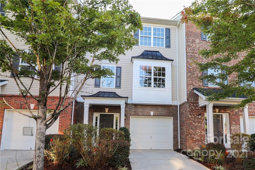 1265 Amber Ridge Road Northwest Concord, NC 28027 - Photo 3 of 26 a front view of a house with a garden