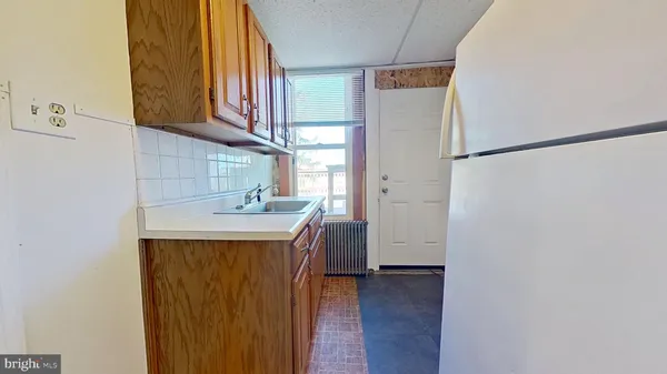 a view of a bathroom with a sink and a bath tub