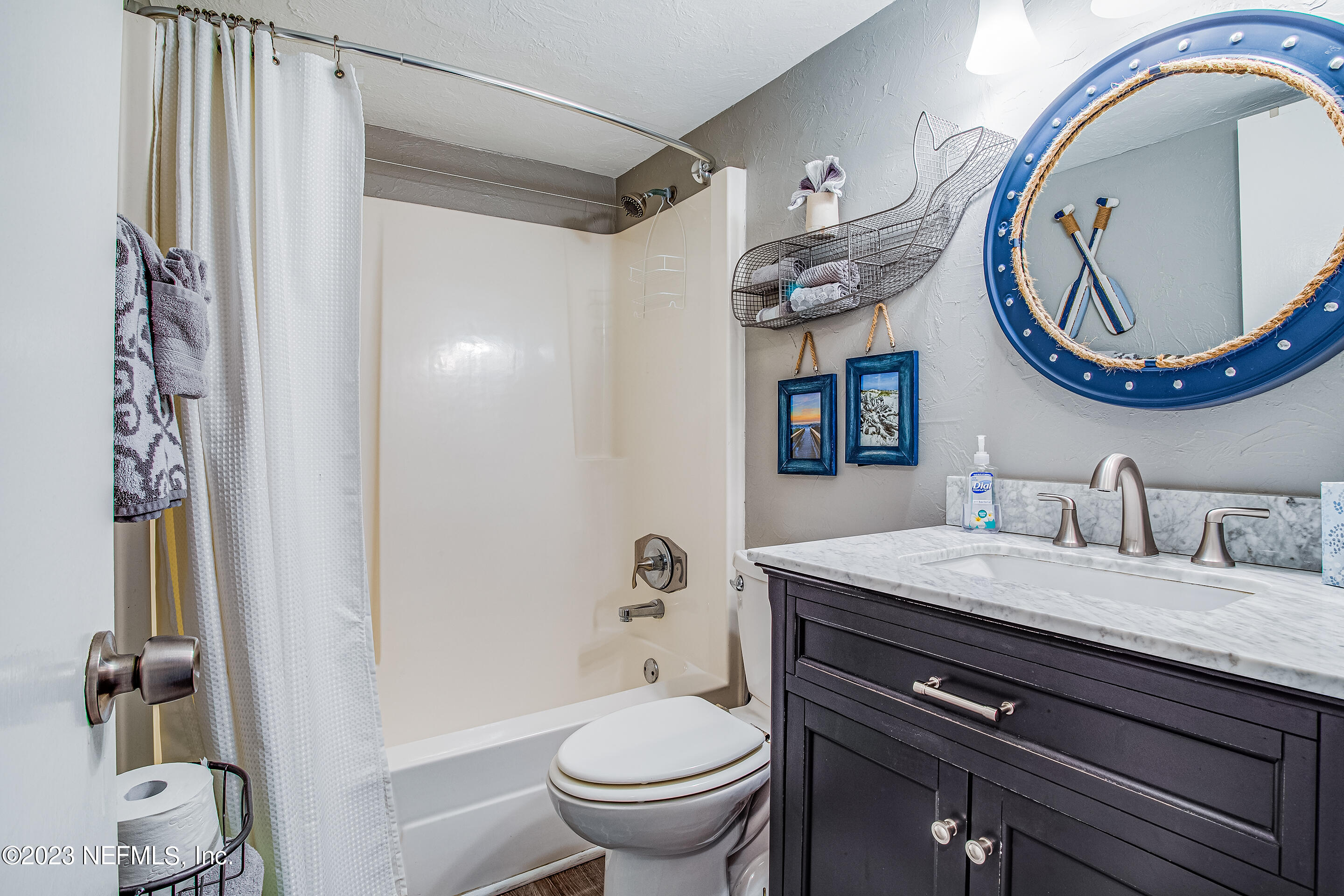 4 Ocean Trace Road, Unit 224 St. Augustine, FL 32080 - Photo 12 of 36 a bathroom with a toilet a sink and a mirror