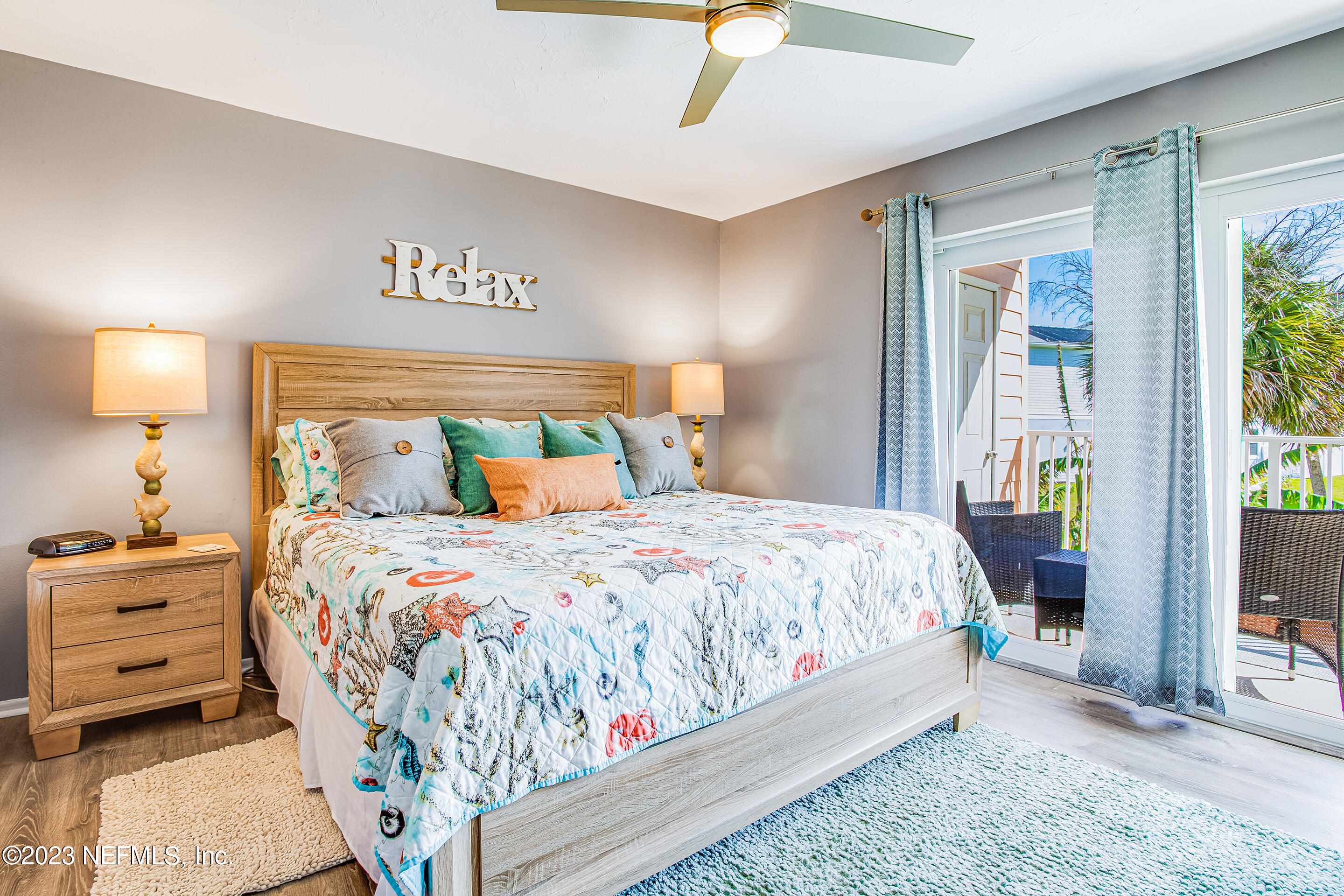 4 Ocean Trace Road, Unit 224 St. Augustine, FL 32080 - Photo 13 of 36 a bedroom with a bed and a lamp