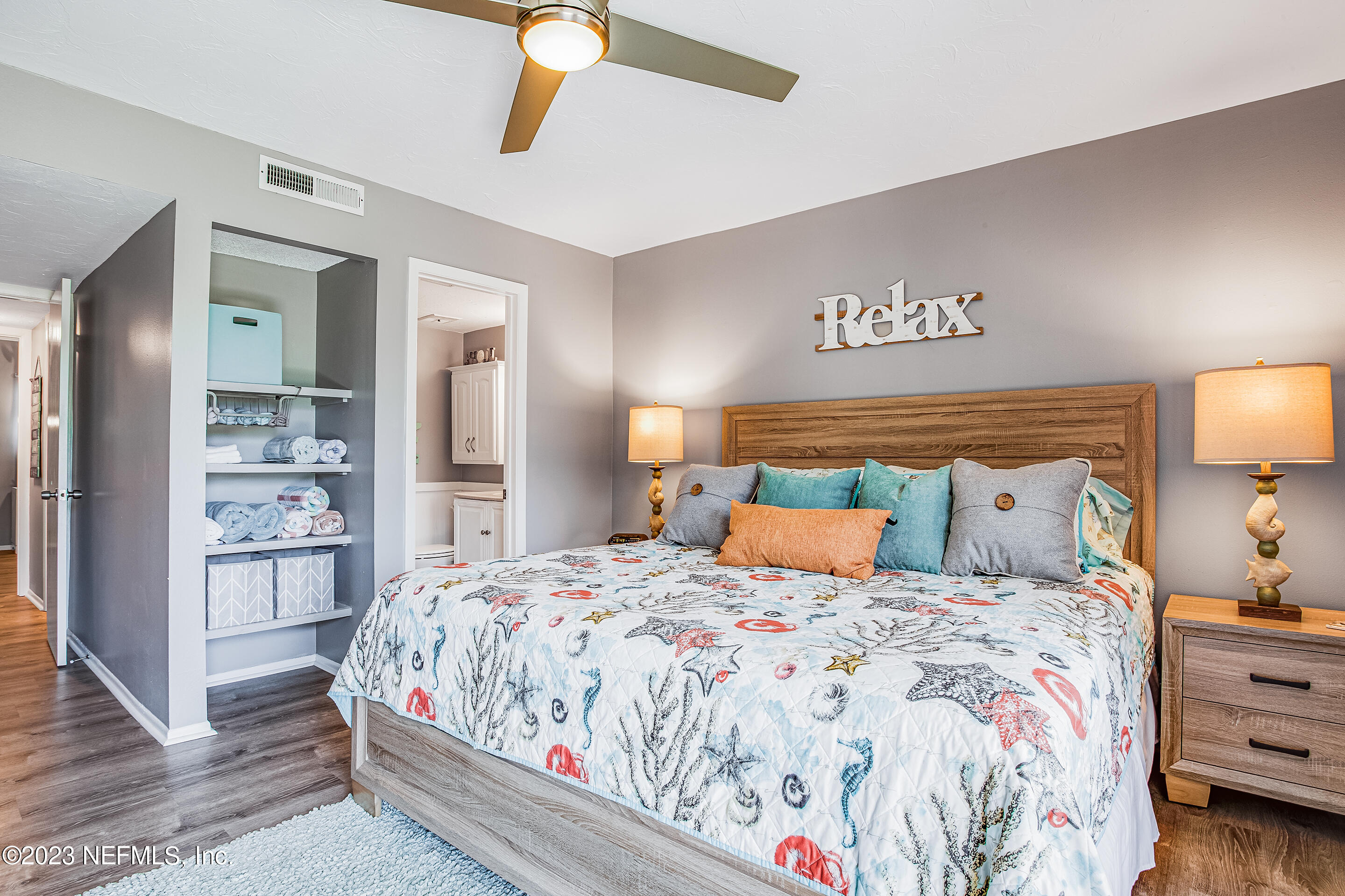 4 Ocean Trace Road, Unit 224 St. Augustine, FL 32080 - Photo 14 of 36 a bedroom with a large bed and a lamp