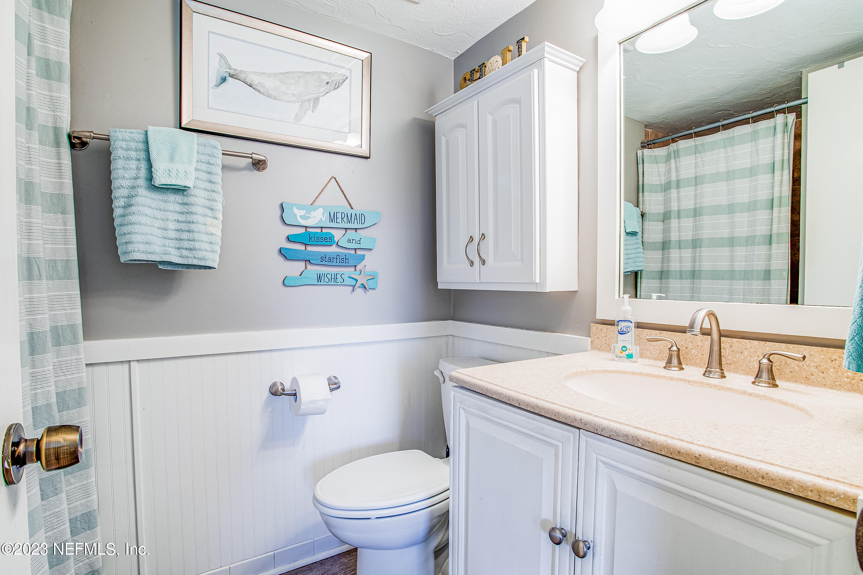 4 Ocean Trace Road, Unit 224 St. Augustine, FL 32080 - Photo 16 of 36 a bathroom with a sink and a mirror