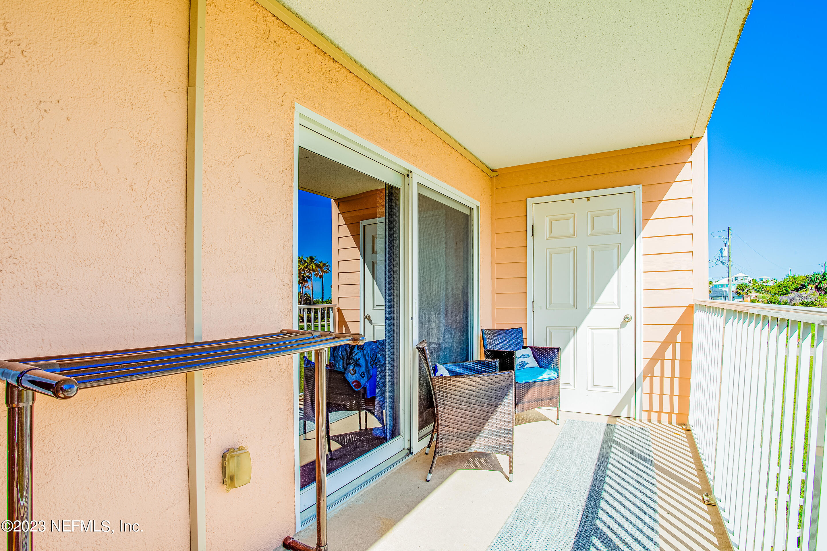 4 Ocean Trace Road, Unit 224 St. Augustine, FL 32080 - Photo 17 of 36 a view of living room with large windows and stairs