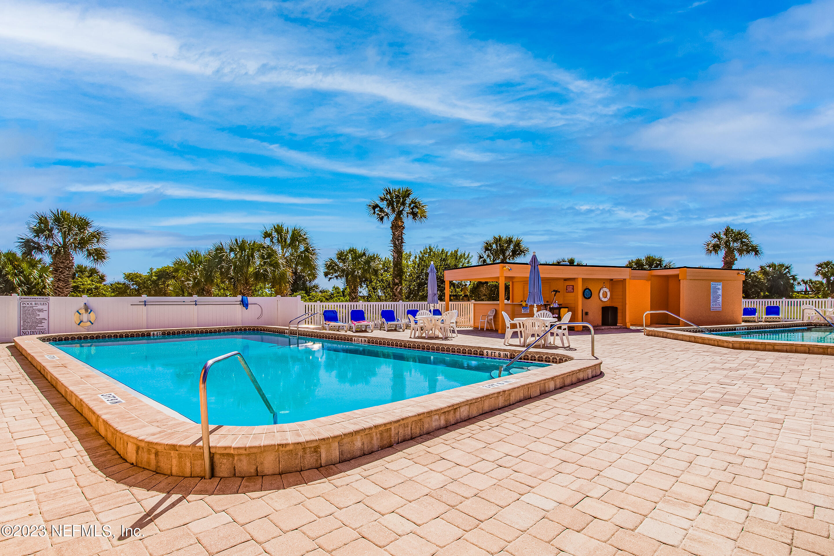 4 Ocean Trace Road, Unit 224 St. Augustine, FL 32080 - Photo 23 of 36 a view of a swimming pool with an outdoor seating