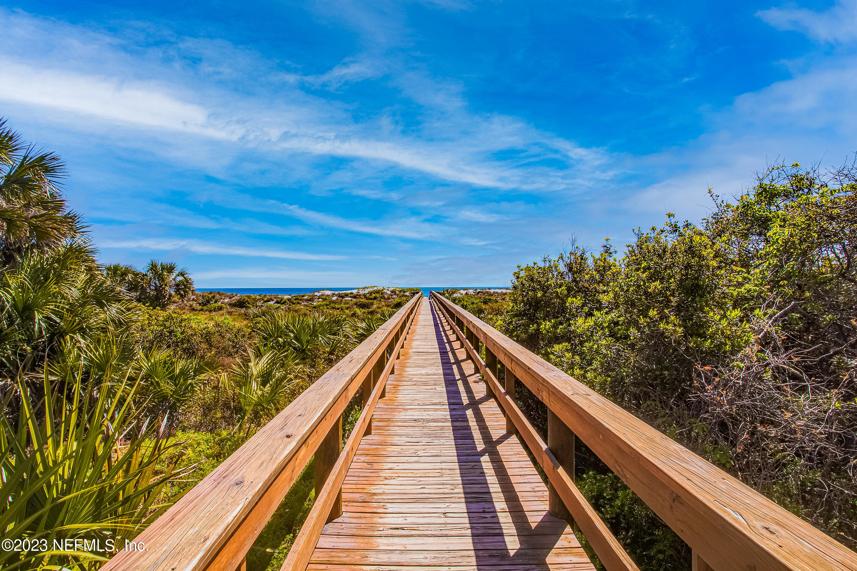 4 Ocean Trace Road, Unit 224 St. Augustine, FL 32080 - Photo 27 of 36 a view from balcony with wooden floor and fence