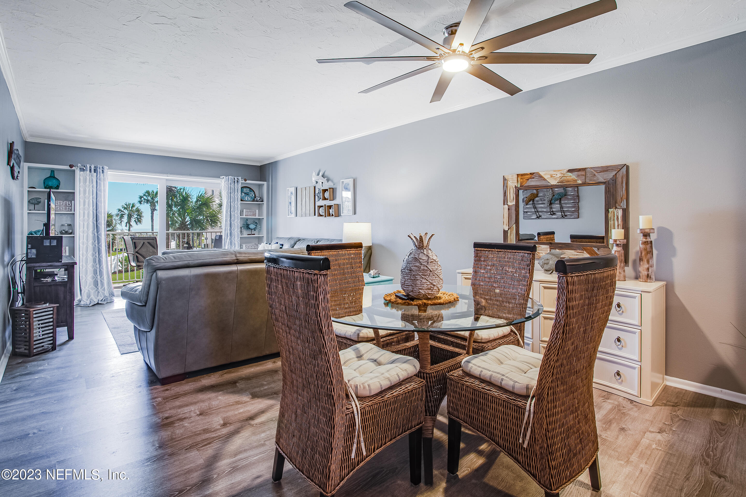 4 Ocean Trace Road, Unit 224 St. Augustine, FL 32080 - Photo 7 of 36 a living room with furniture and a large window