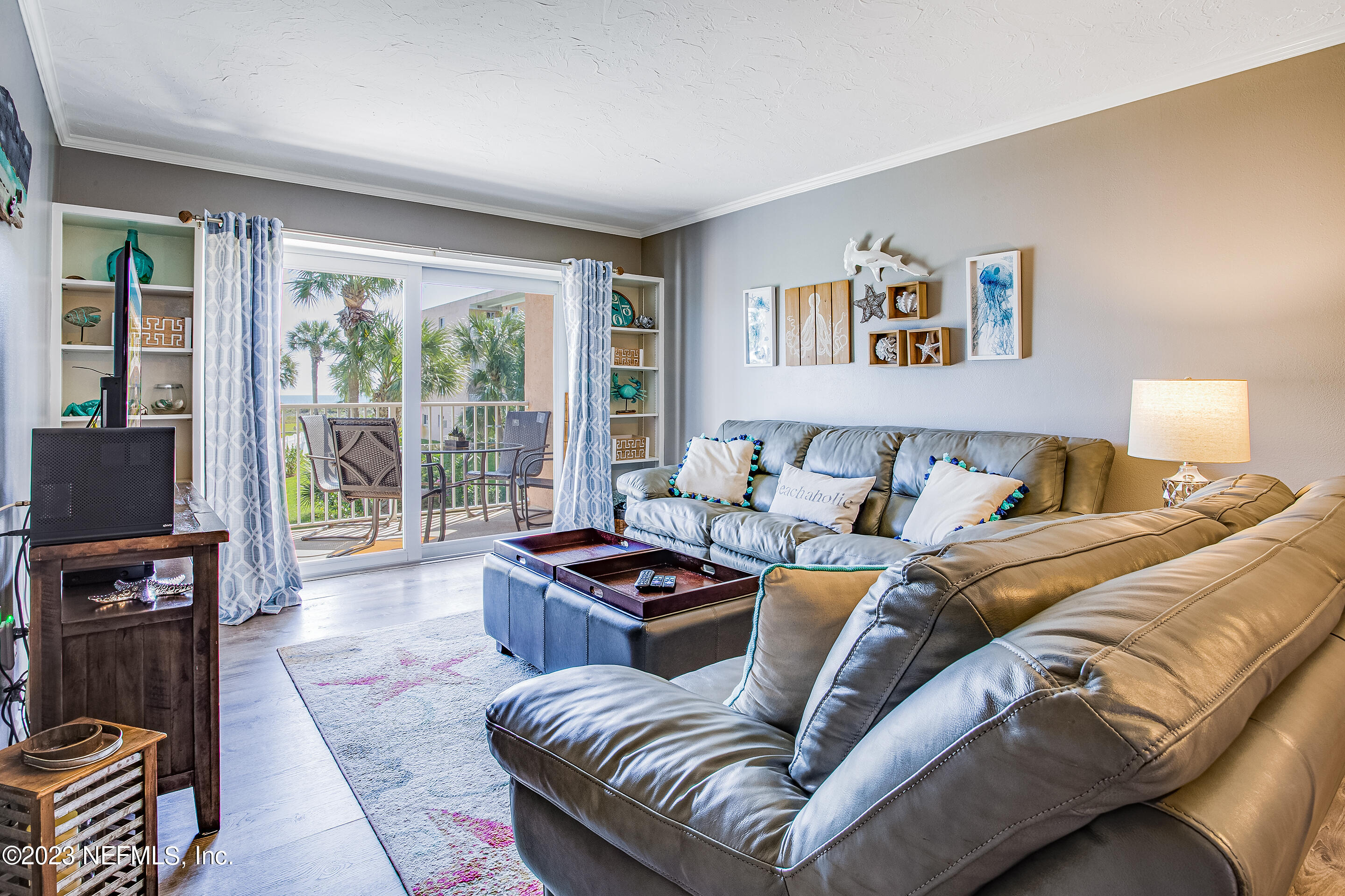4 Ocean Trace Road, Unit 224 St. Augustine, FL 32080 - Photo 8 of 36 a living room with furniture and a flat screen tv
