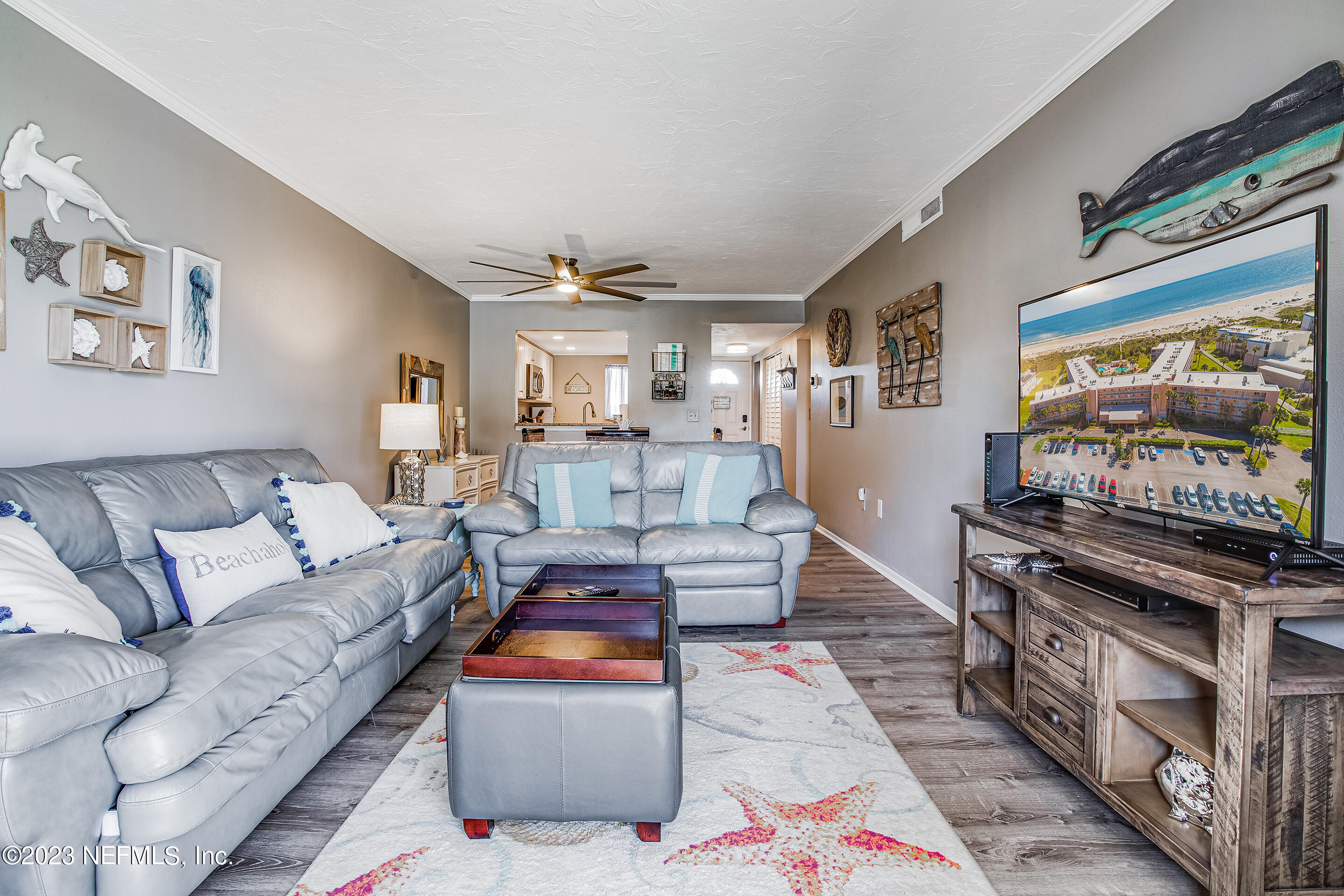 4 Ocean Trace Road, Unit 224 St. Augustine, FL 32080 - Photo 9 of 36 a living room with furniture and a flat screen tv