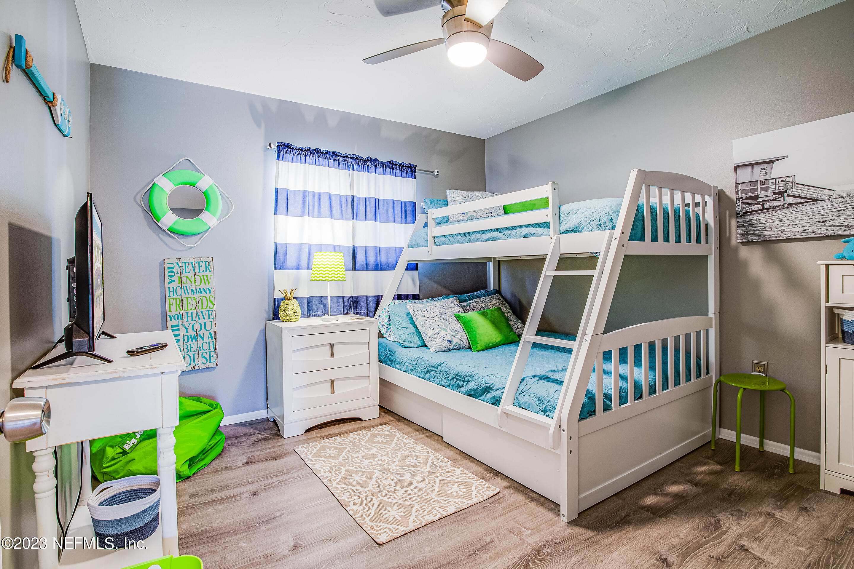 4 Ocean Trace Road, Unit 224 St. Augustine, FL 32080 - Photo 10 of 36 a bedroom with a bed and a flat tv screen on dresser