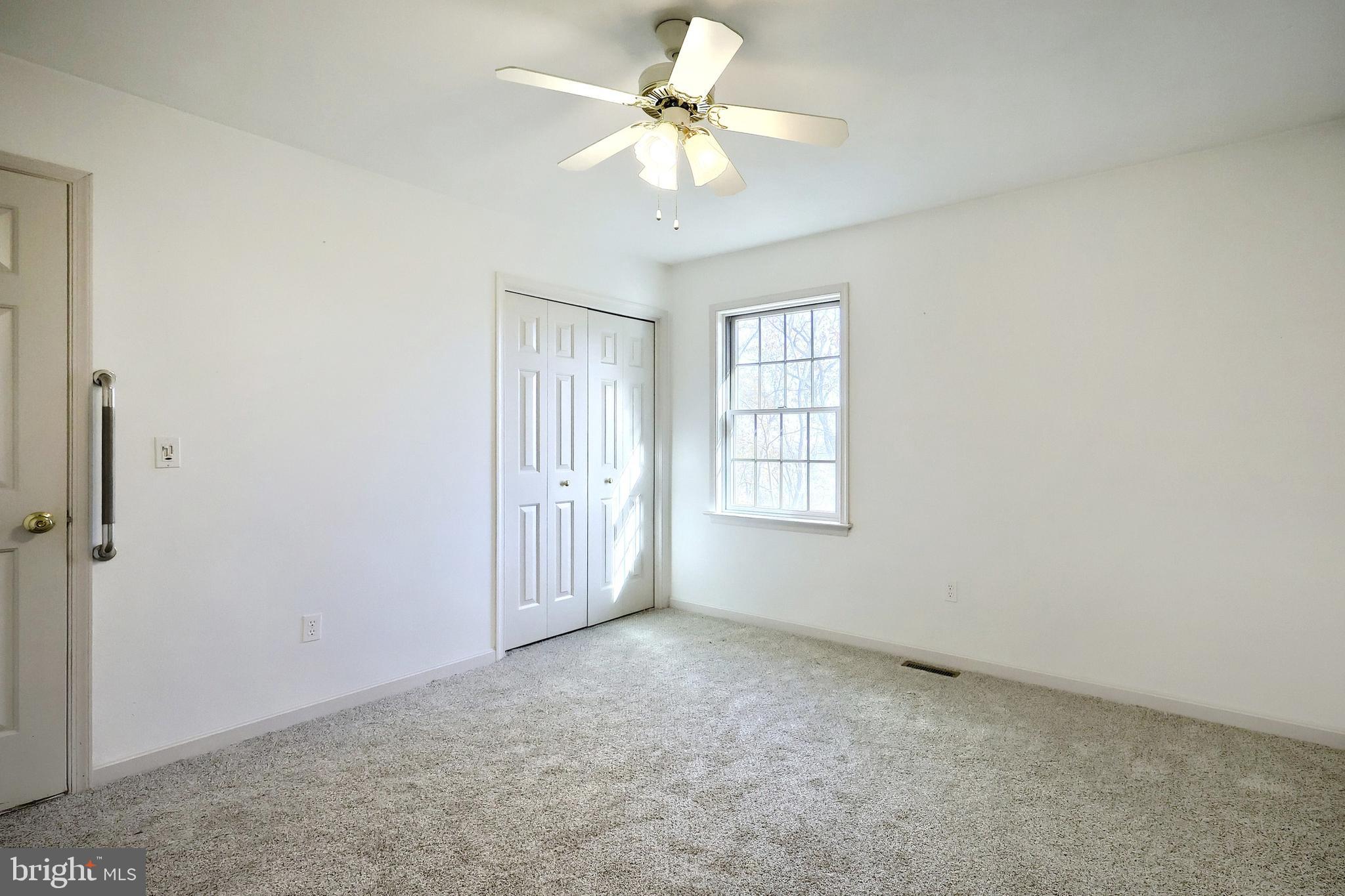 65 Scarlet Way Biglerville, PA 17307 - Photo 15 of 34 an empty room with windows and ceiling fan