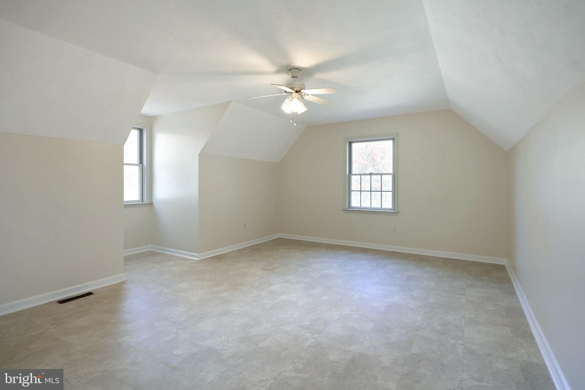 65 Scarlet Way Biglerville, PA 17307 - Photo 23 of 34 an empty room with a window and a fan