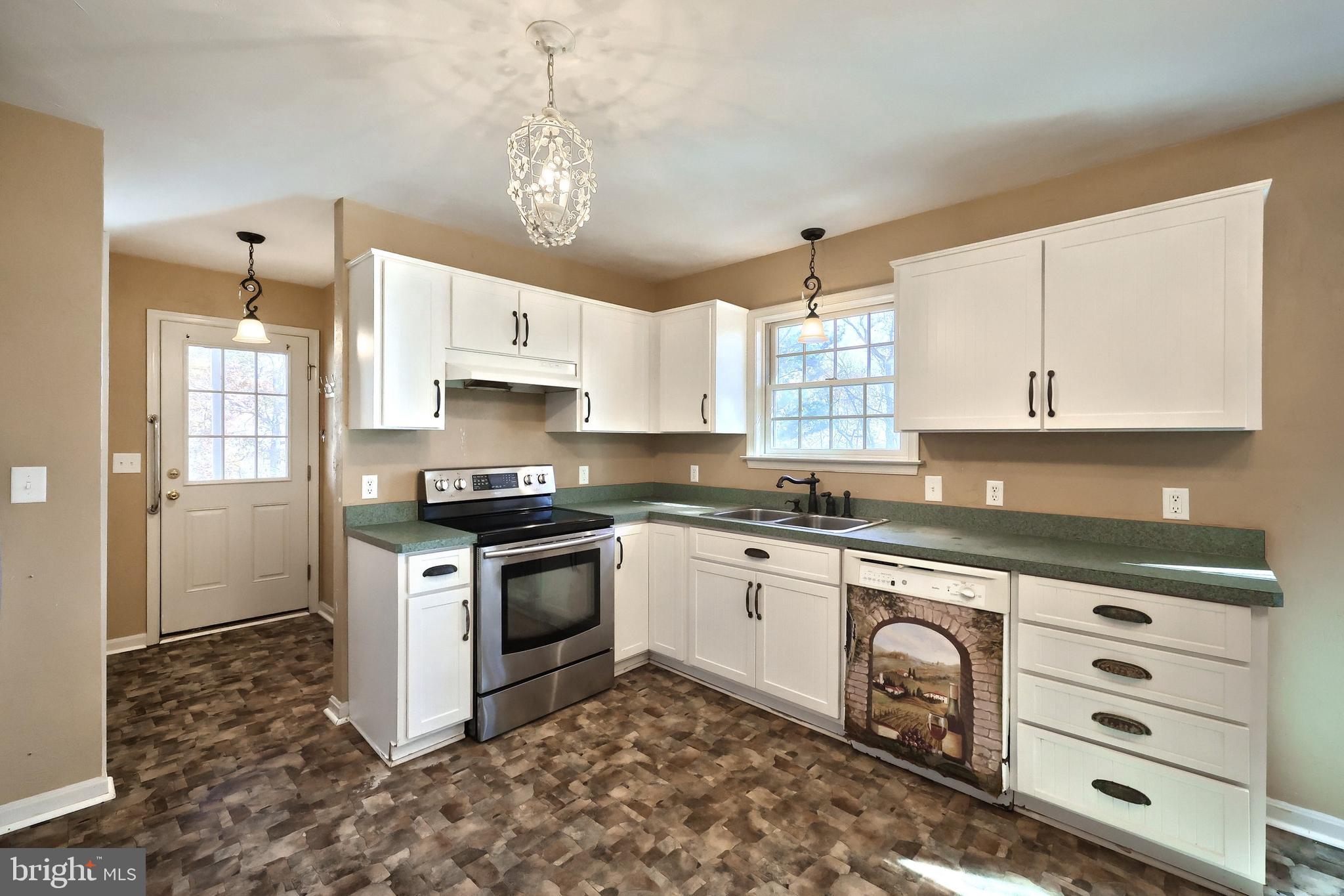 65 Scarlet Way Biglerville, PA 17307 - Photo 8 of 34 a kitchen with a stove a sink and a refrigerator