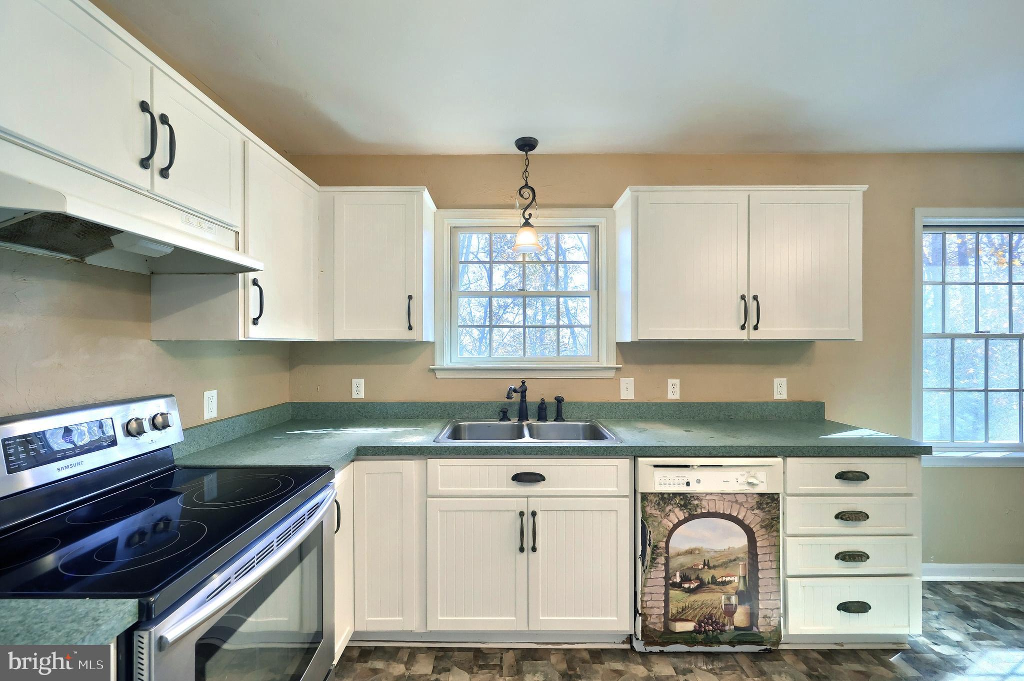 65 Scarlet Way Biglerville, PA 17307 - Photo 10 of 34 a kitchen with granite countertop a sink a stove and cabinets