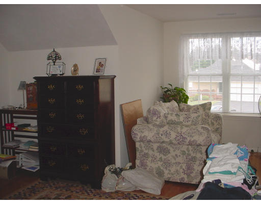 31 Cold Spring Drive, Unit C Sutton, MA 01590 - Photo 14 of 20 a living room with furniture and a window