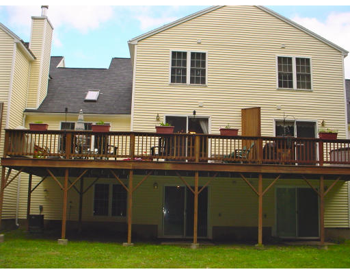 31 Cold Spring Drive, Unit C Sutton, MA 01590 - Photo 16 of 20 a view of a house with a deck