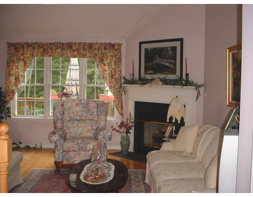 31 Cold Spring Drive, Unit C Sutton, MA 01590 - Photo 3 of 20 a living room with furniture a flat screen tv and a fireplace
