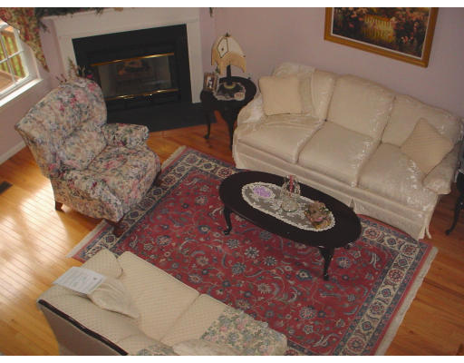 31 Cold Spring Drive, Unit C Sutton, MA 01590 - Photo 5 of 20 a living room with furniture and a fireplace