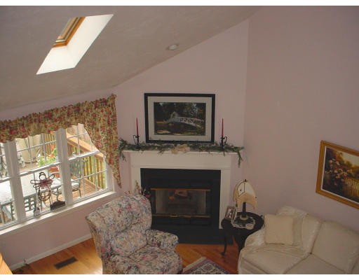31 Cold Spring Drive, Unit C Sutton, MA 01590 - Photo 6 of 20 a living room with furniture a fireplace and a large window