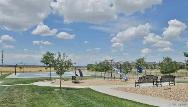 a view of a backyard with sitting area