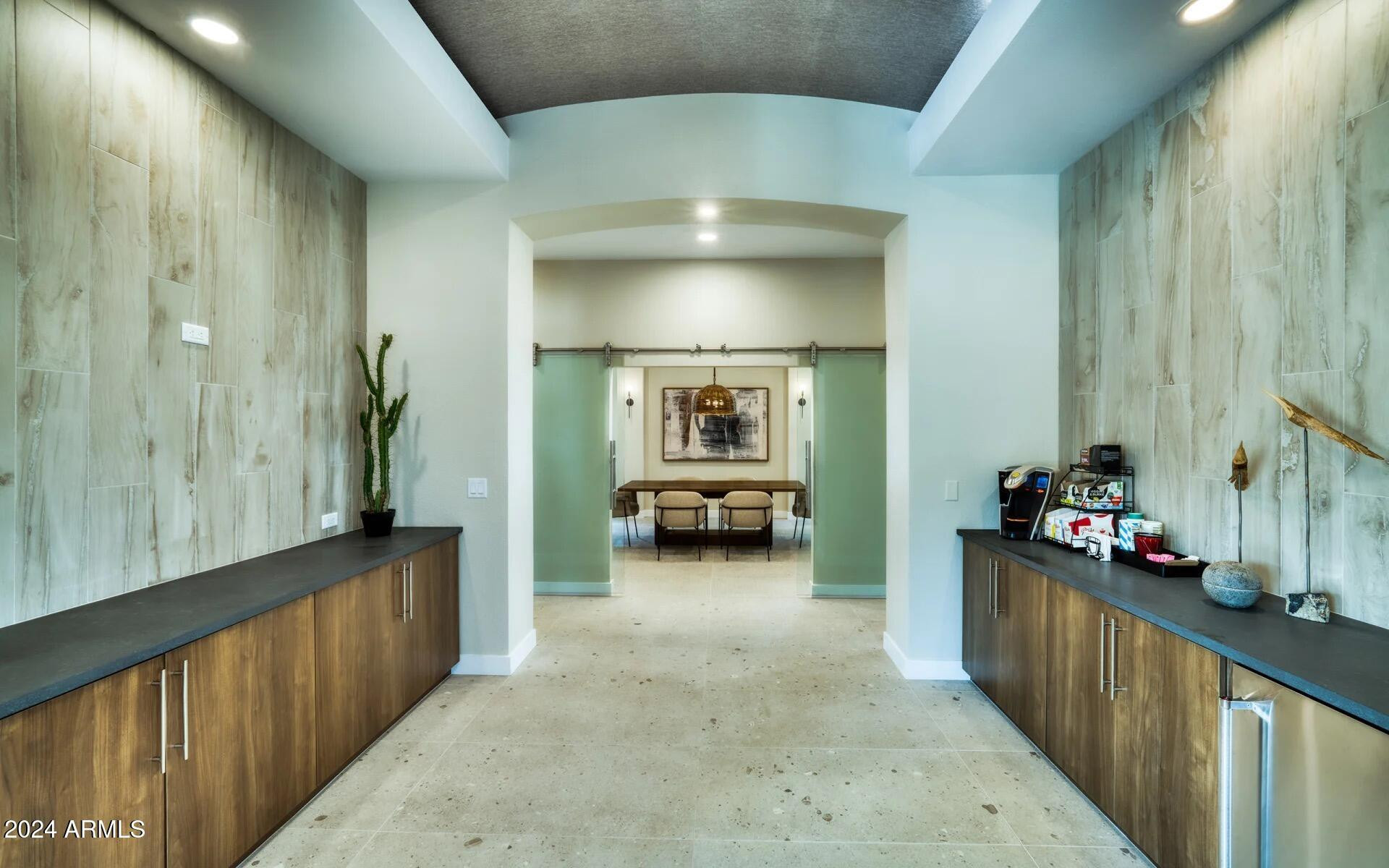3625 East Ray Road, Unit 1 Phoenix, AZ 85044 - Photo 14 of 29 a view of a hallway to a livingroom with wooden floor and furniture
