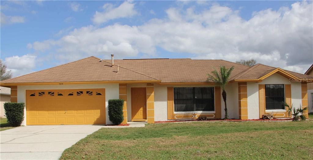 1075 Jennie Ridge Trail Kissimmee, FL 34747 - Photo 1 of 1 a view of a house with a yard and large tree