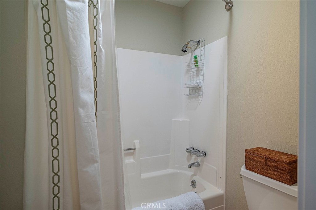612 Karenken Pines Drive Lake Arrowhead, CA 92391 - Photo 20 of 44 a bathroom with a bathtub and a shower